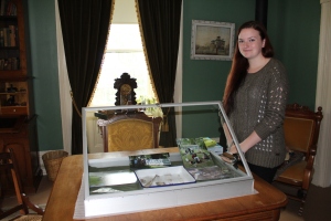 Jodie with the display case she 'curated' for International Archaeology Day in October