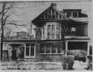 Black and white photograph of a two storey house